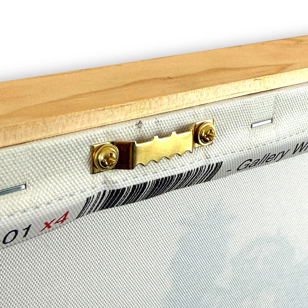 Close-up of the back corner of a canvas print on a wooden frame, showing a brass hanging hardware piece attached to the canvas edge.